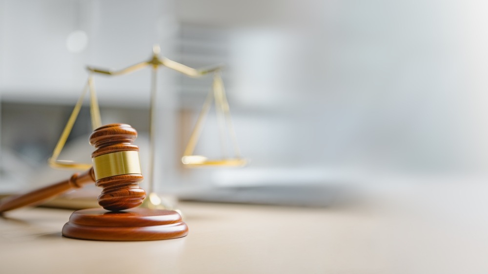 A gavel and scales. We can explain how much a drug defense attorney costs in Seattle.